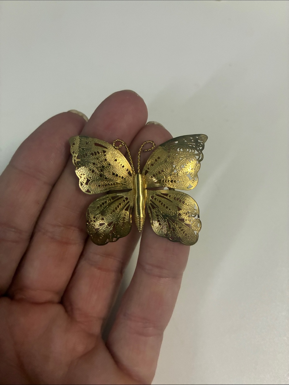 Brass gold toned butterfly pin